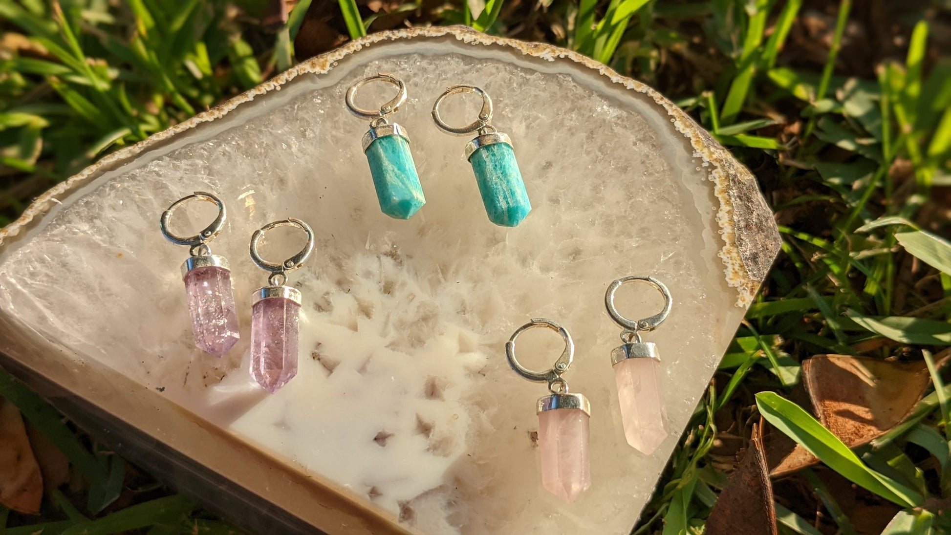 Earth’s Edge Earrings with silver-toned hoops and pointed Brazilian crystal pendants — available in Amazonite, Amethyst, or Rose Quartz – Mother Mystique Jewelry